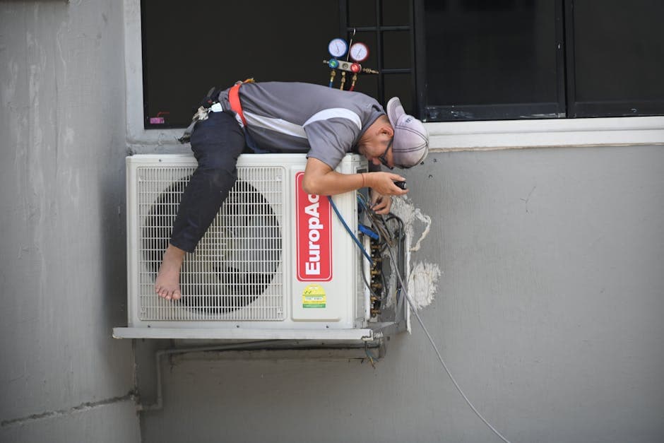 Professional technician working on air conditioning system