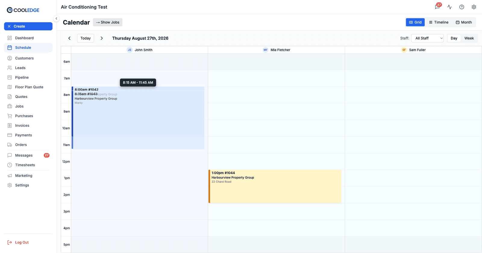 A booking mid-drag on the calendar, with the card following the cursor towards a new slot