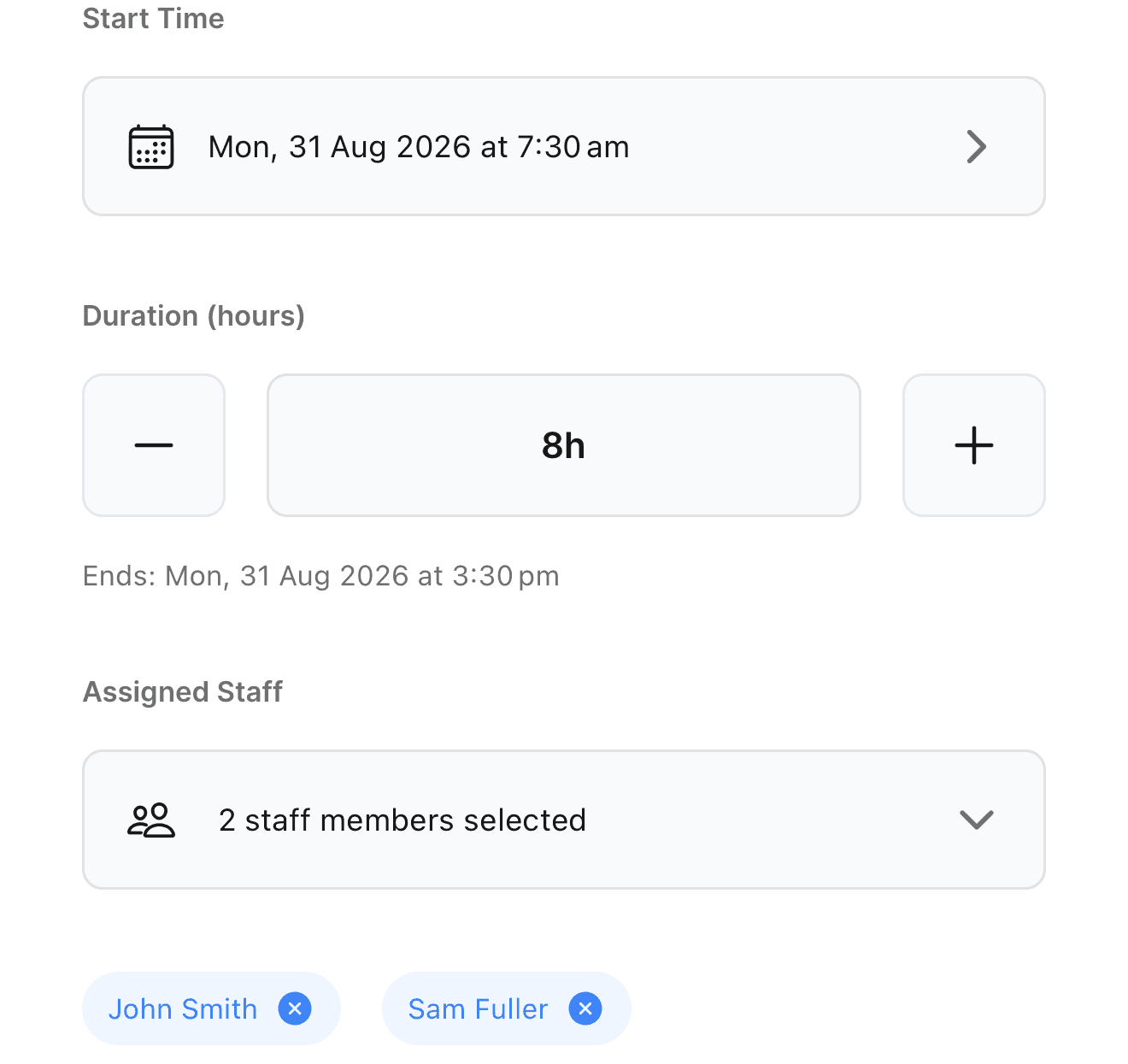The mobile Edit Booking sheet with two staff members assigned, shown as removable chips under the Assigned Staff picker